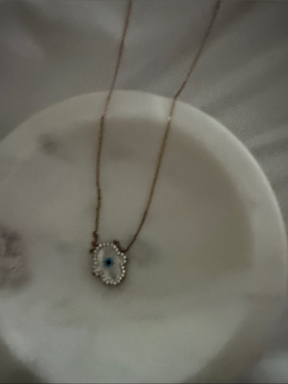 Hamsa necklace in pink gold
